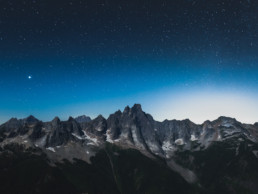 Mount Slesse, near Chilliwack BC, is seen at night. The rich blue sky is full of stars.