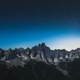 Mount Slesse, near Chilliwack BC, is seen at night. The rich blue sky is full of stars.